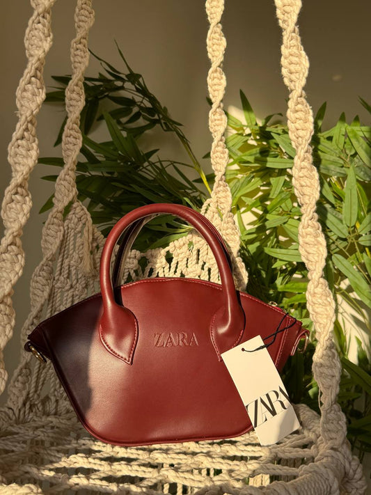 The Sculpted Curve Handbag
