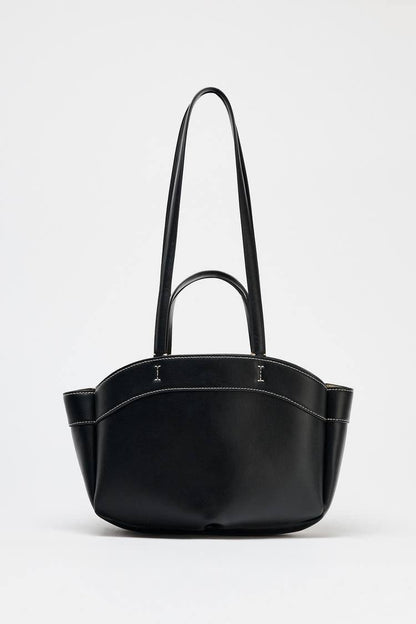 Black handbag with a handle on a white background