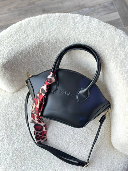 The Sculpted Curve Handbag